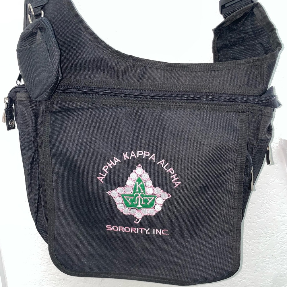Black AKA Messenger Bag perfect for school, work, or conferences.